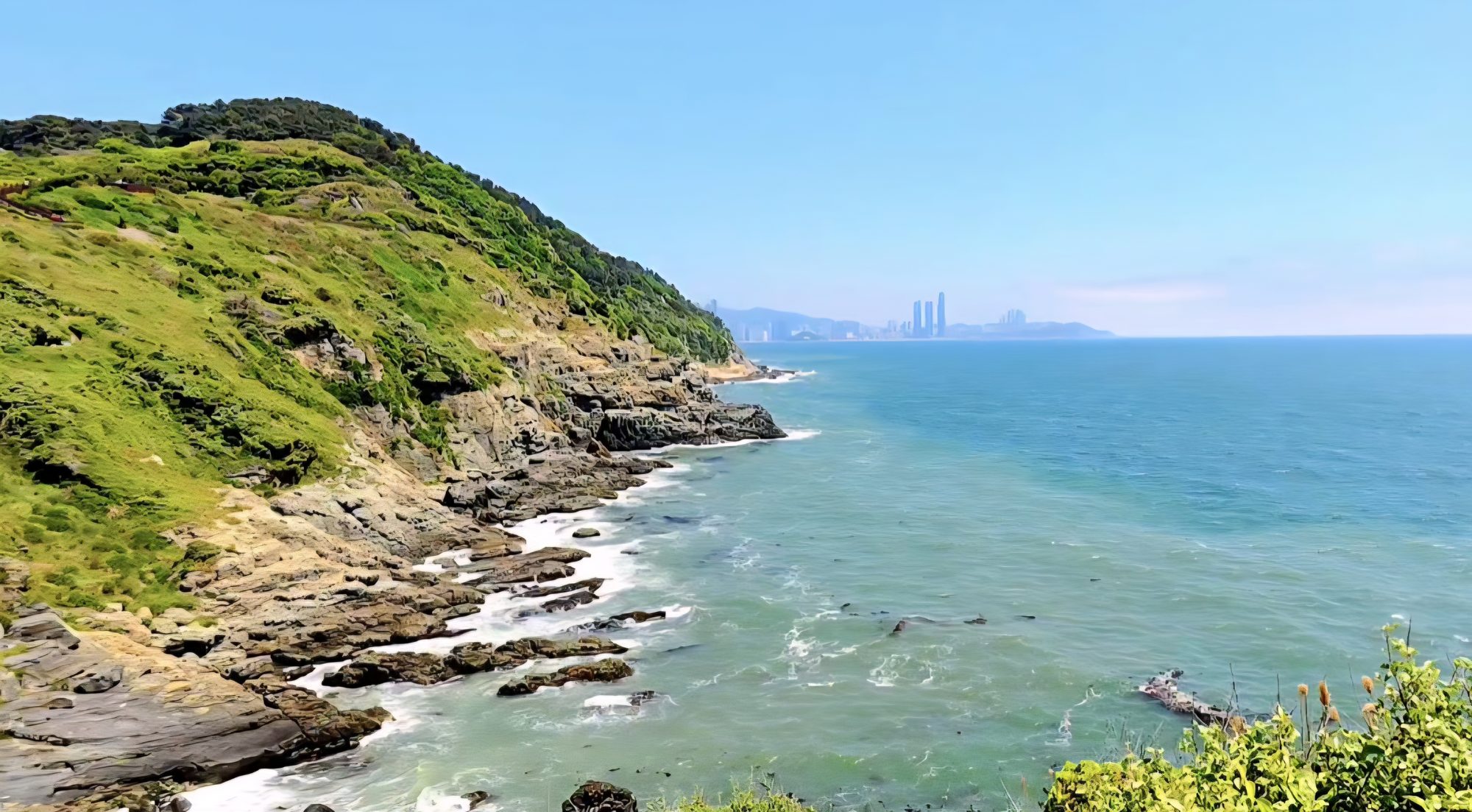 The open coastline near Oryukdo, cliffs meeting the sea