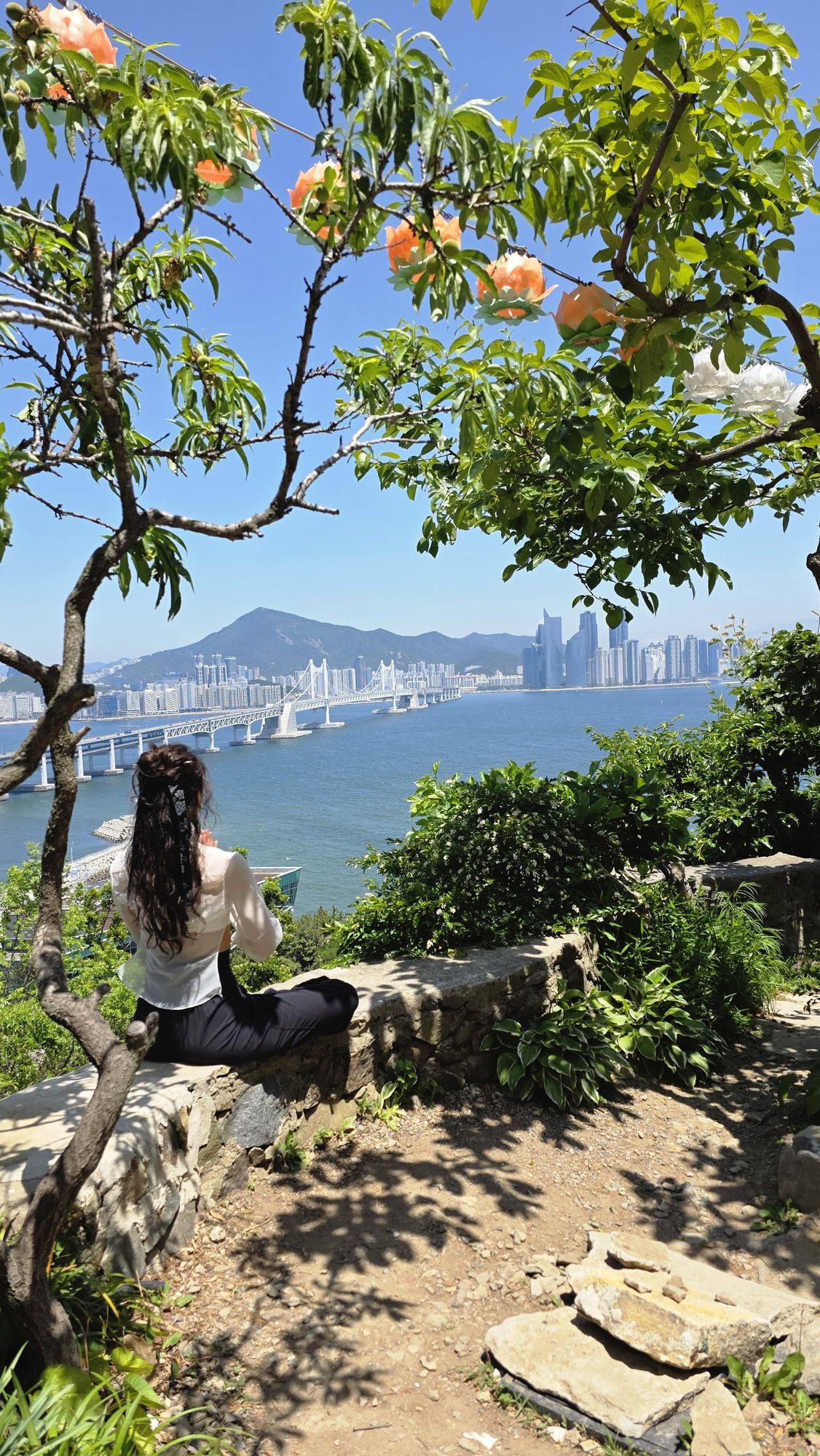 A guest sitting quietly overlooking the coastline
