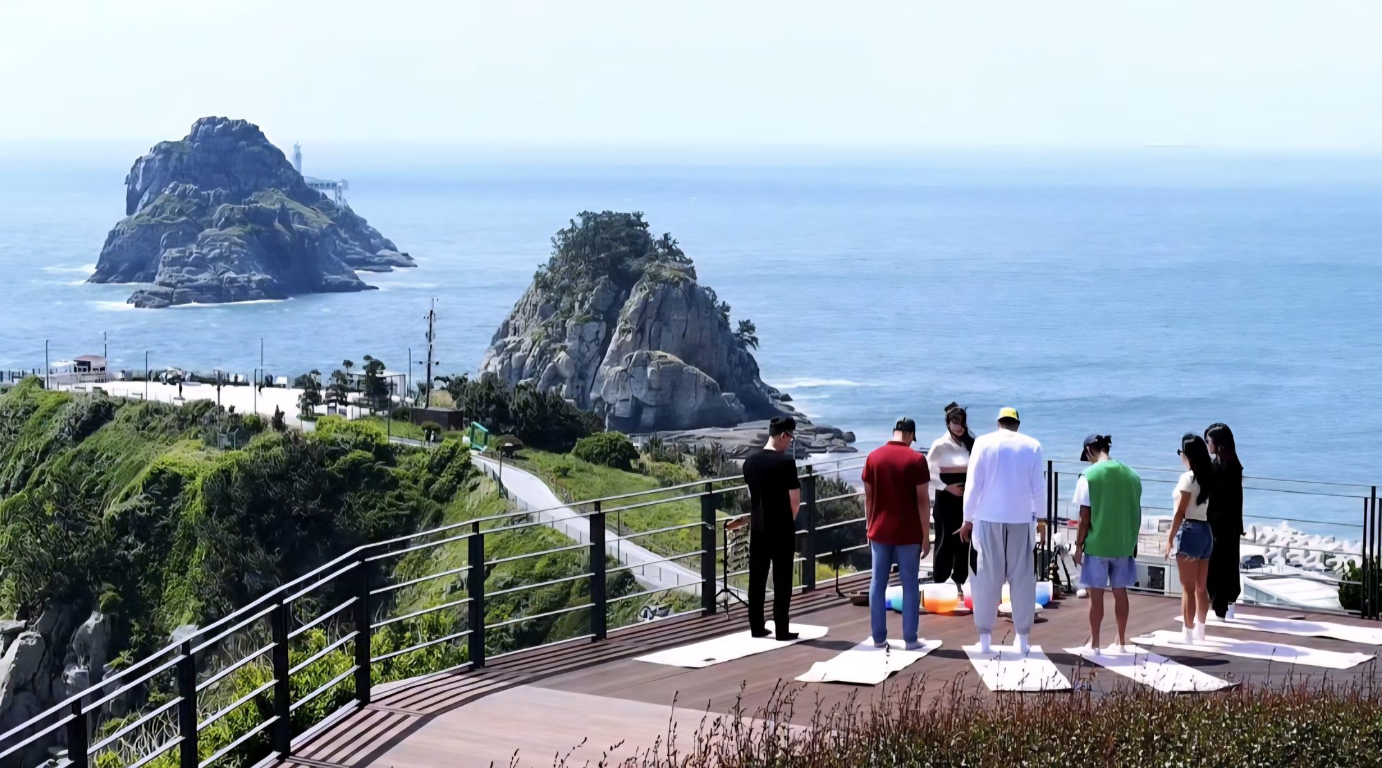 Guests overlooking the Oryukdo islets from the coastal skywalk