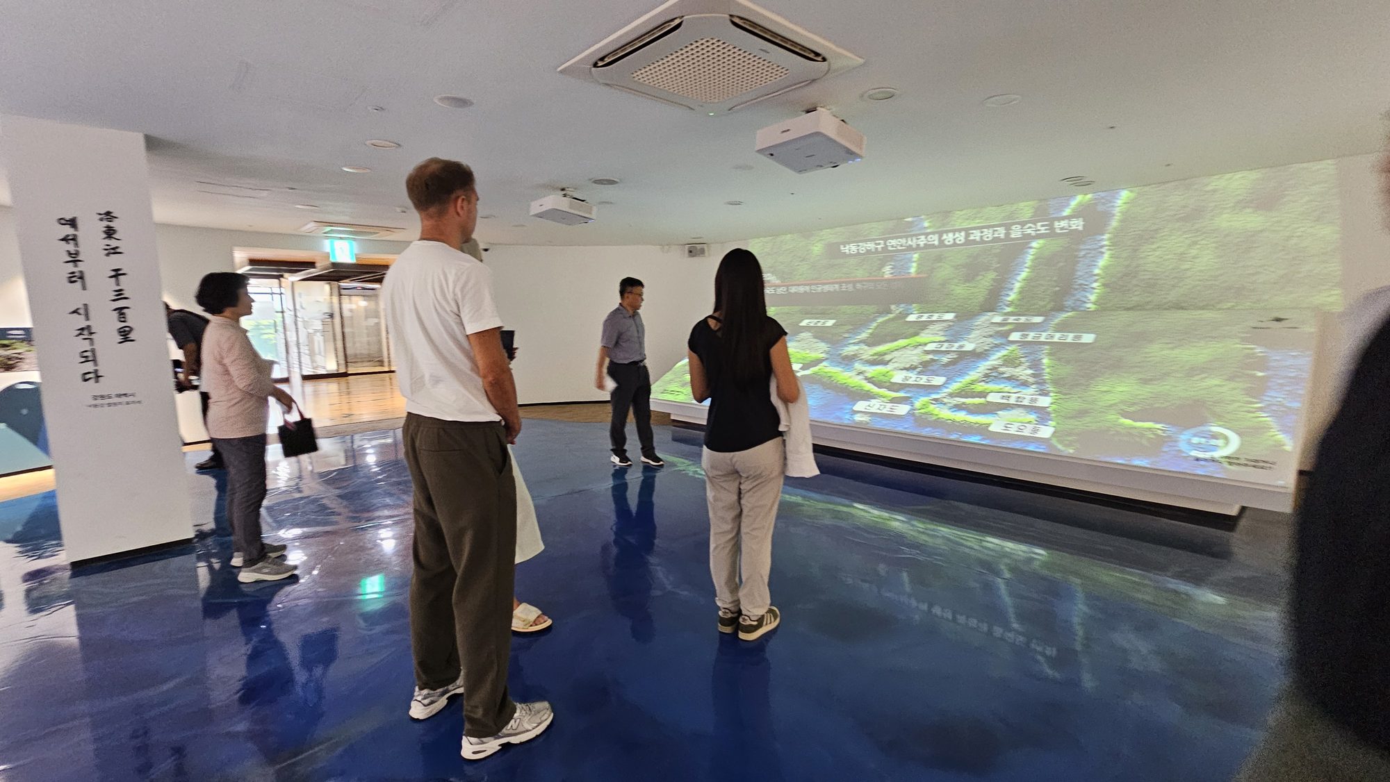 The group taking in a projected map of the estuary's formation