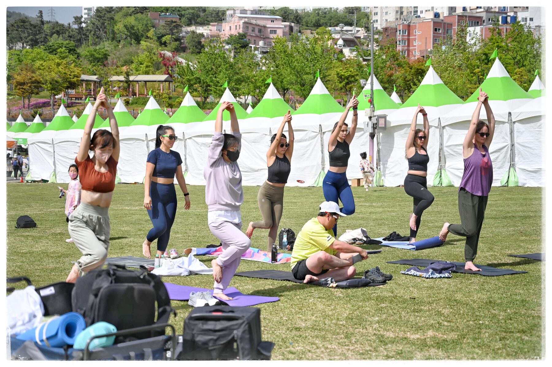 A WellMi outdoor stretching class at a Busan park festival